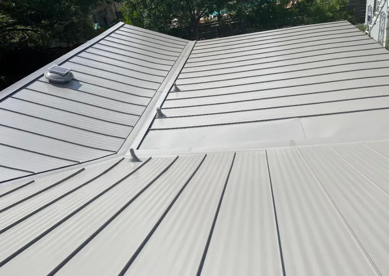 Solar attic fan installed on a metal roof for Roof Ventilation in Carencro